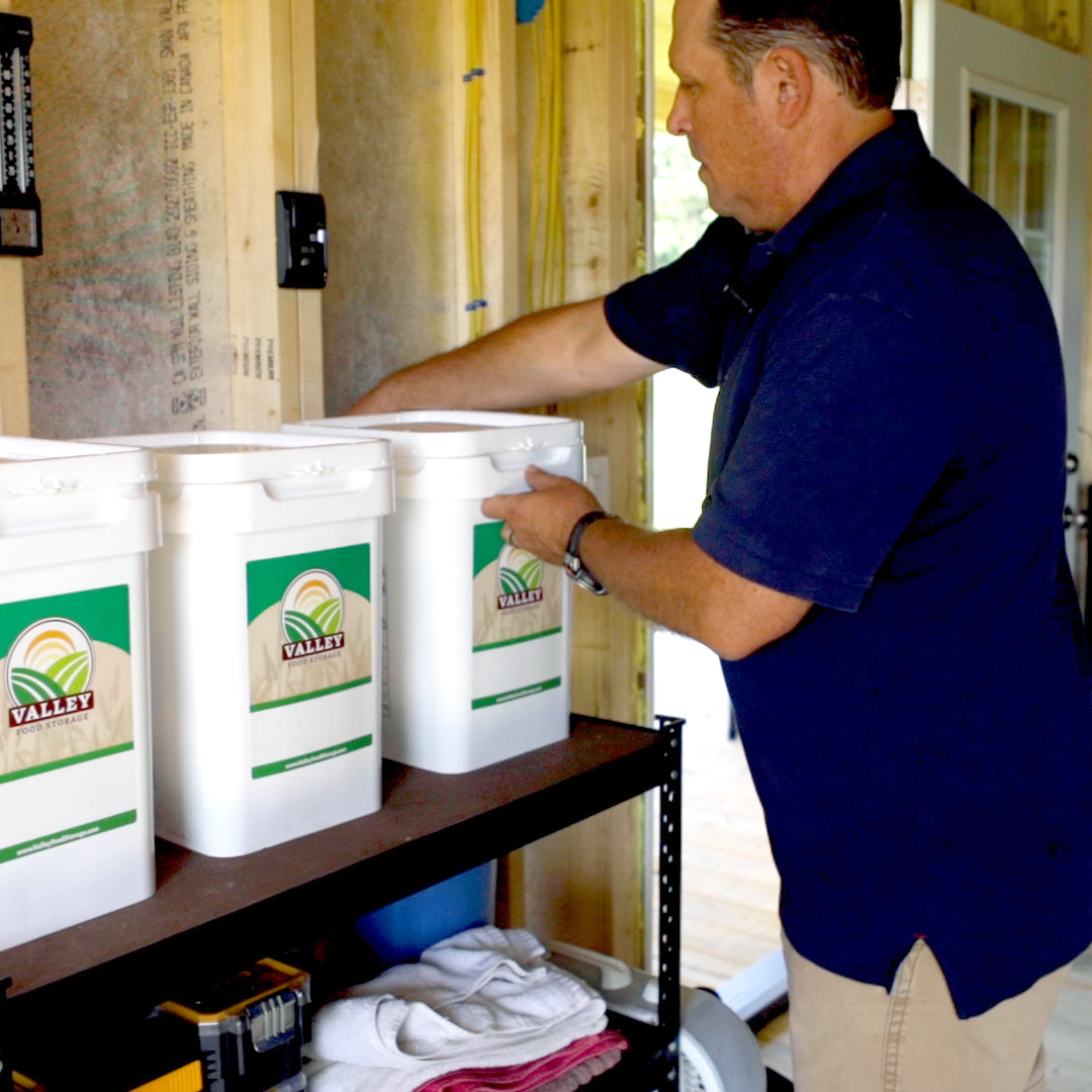 A man fixing the Valley Food Storage Kit